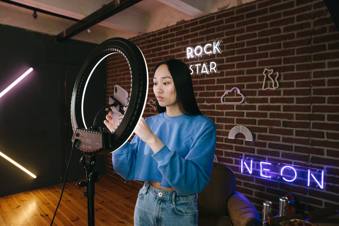 Content creator recording a review on her phone