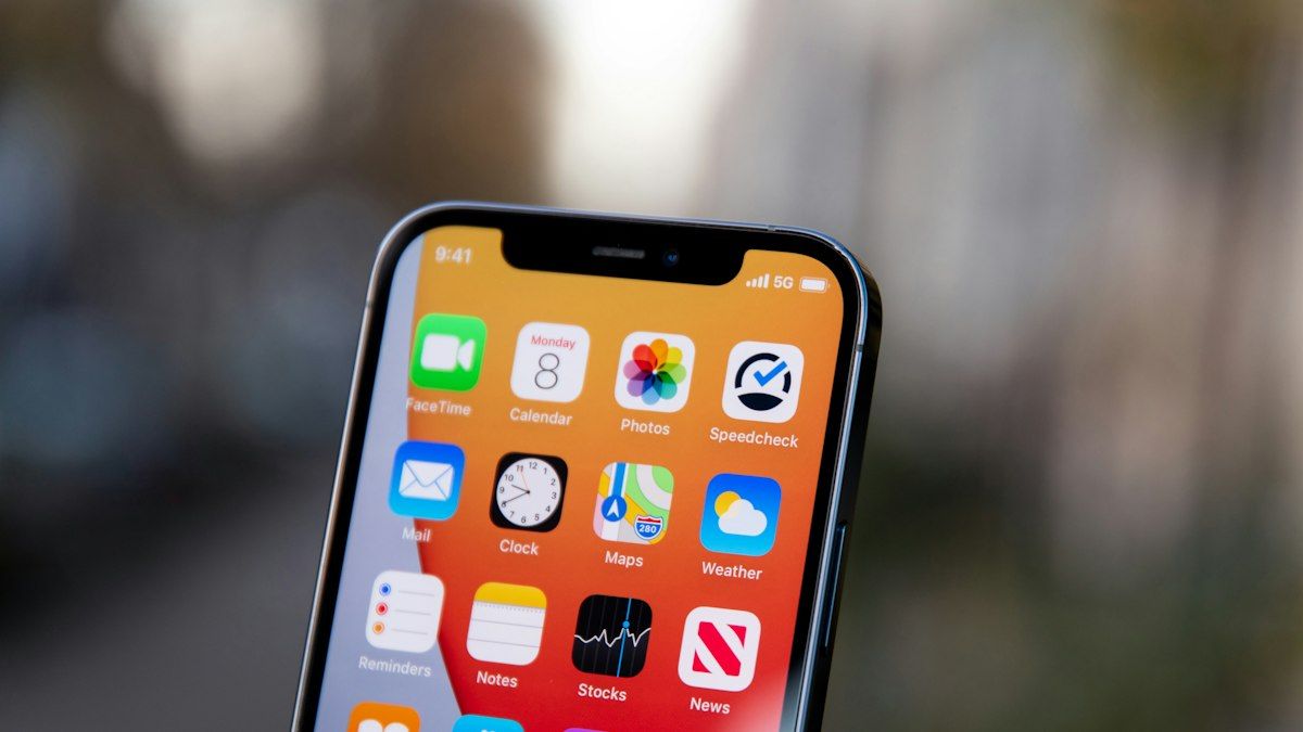 A close-up of a smartphone screen with rows of app icons